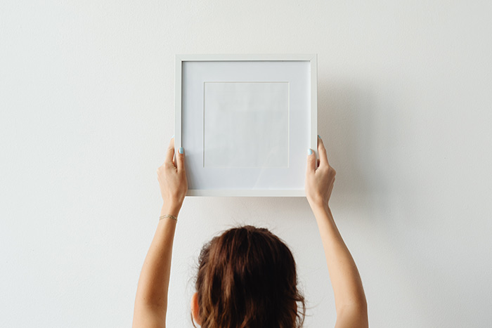 Collector Resources - someone hanging some art